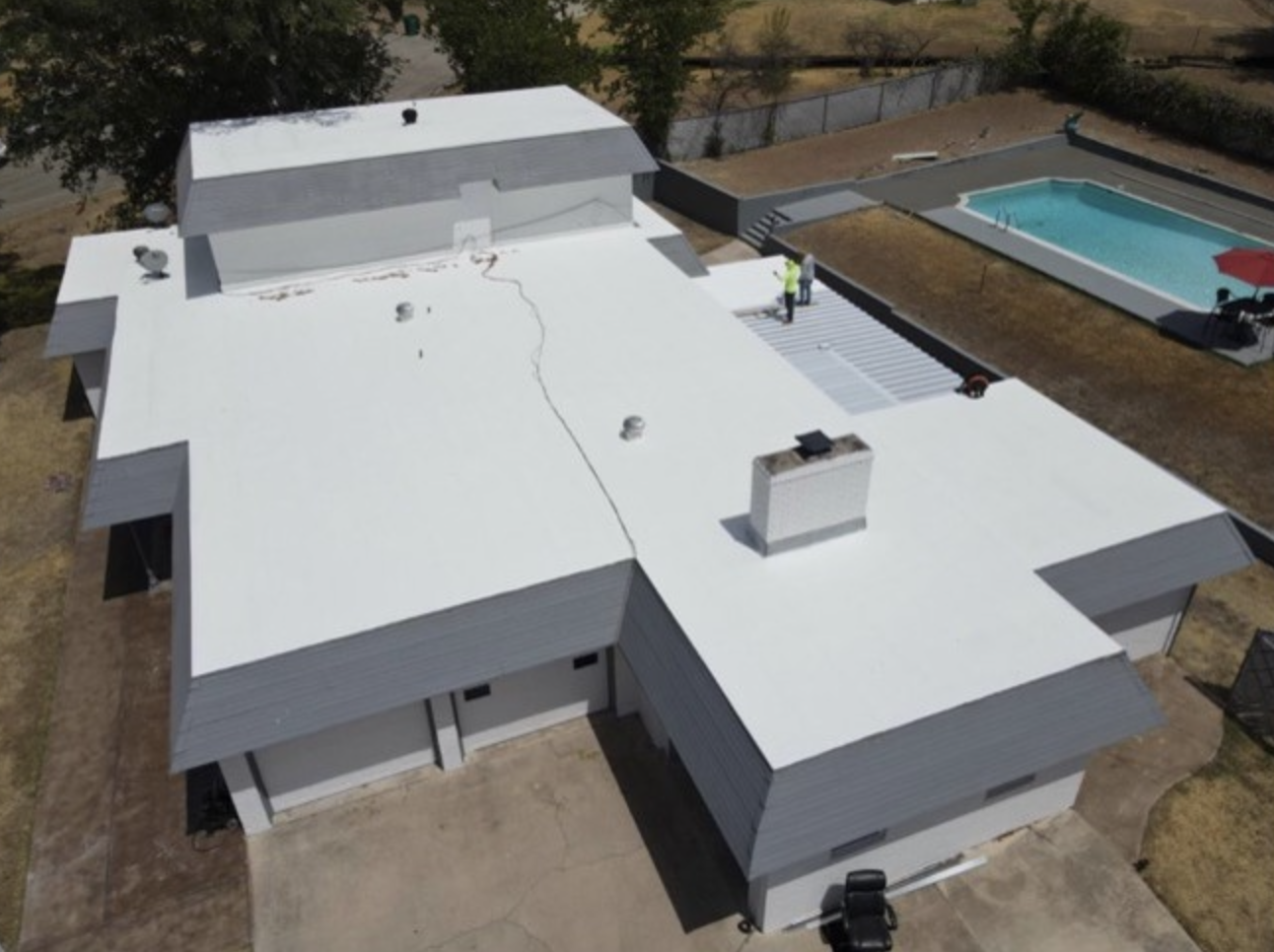 Aerial photo of a coated roof of a commercial building